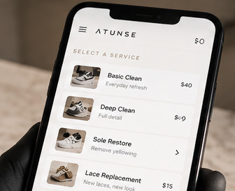 Choosing a service in the Atunṣe booking flow on a phone