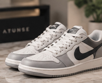 A freshly cleaned pair of sneakers beside an Atunṣe box